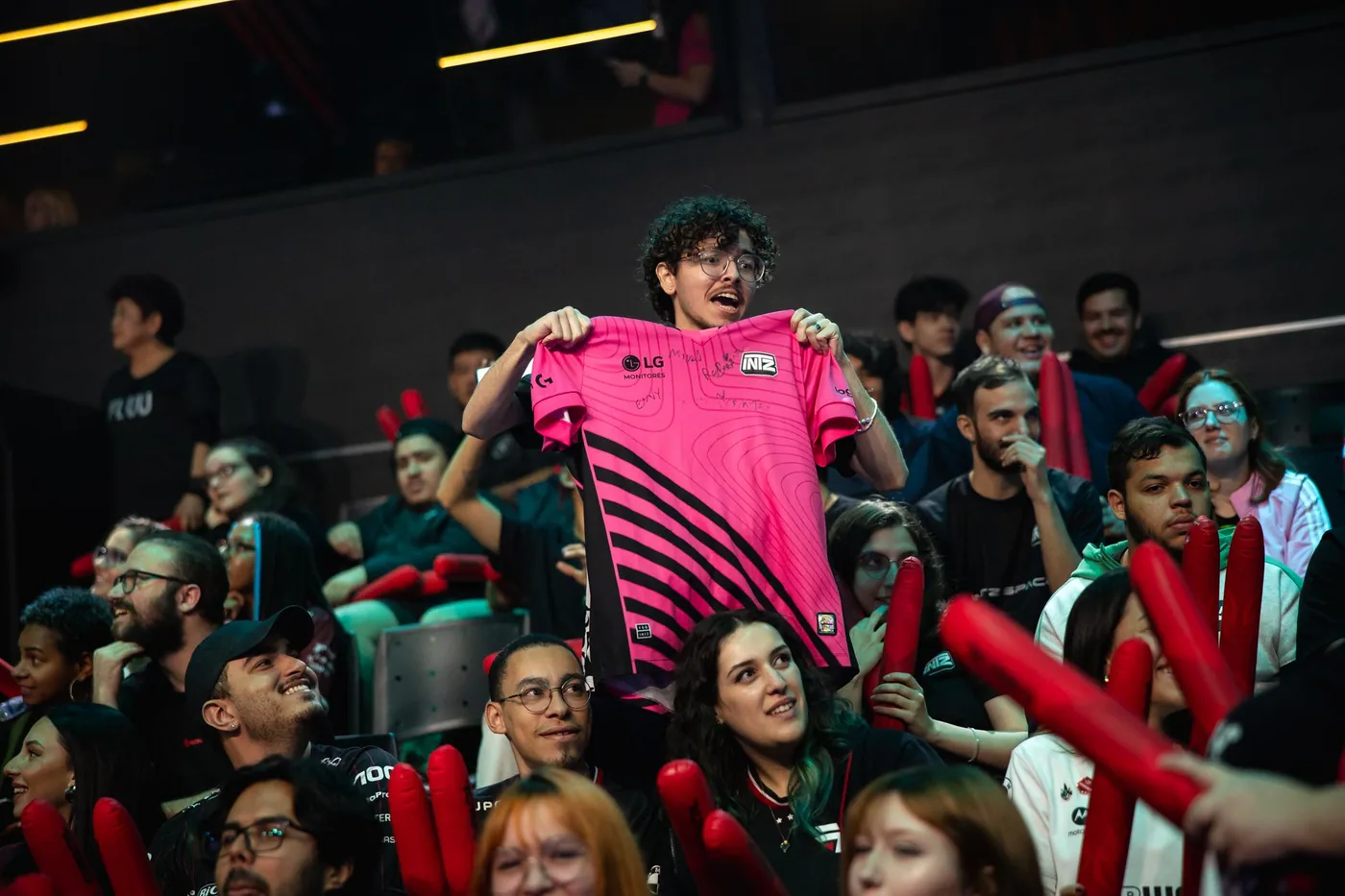 INTZ fans holding up the club jersey